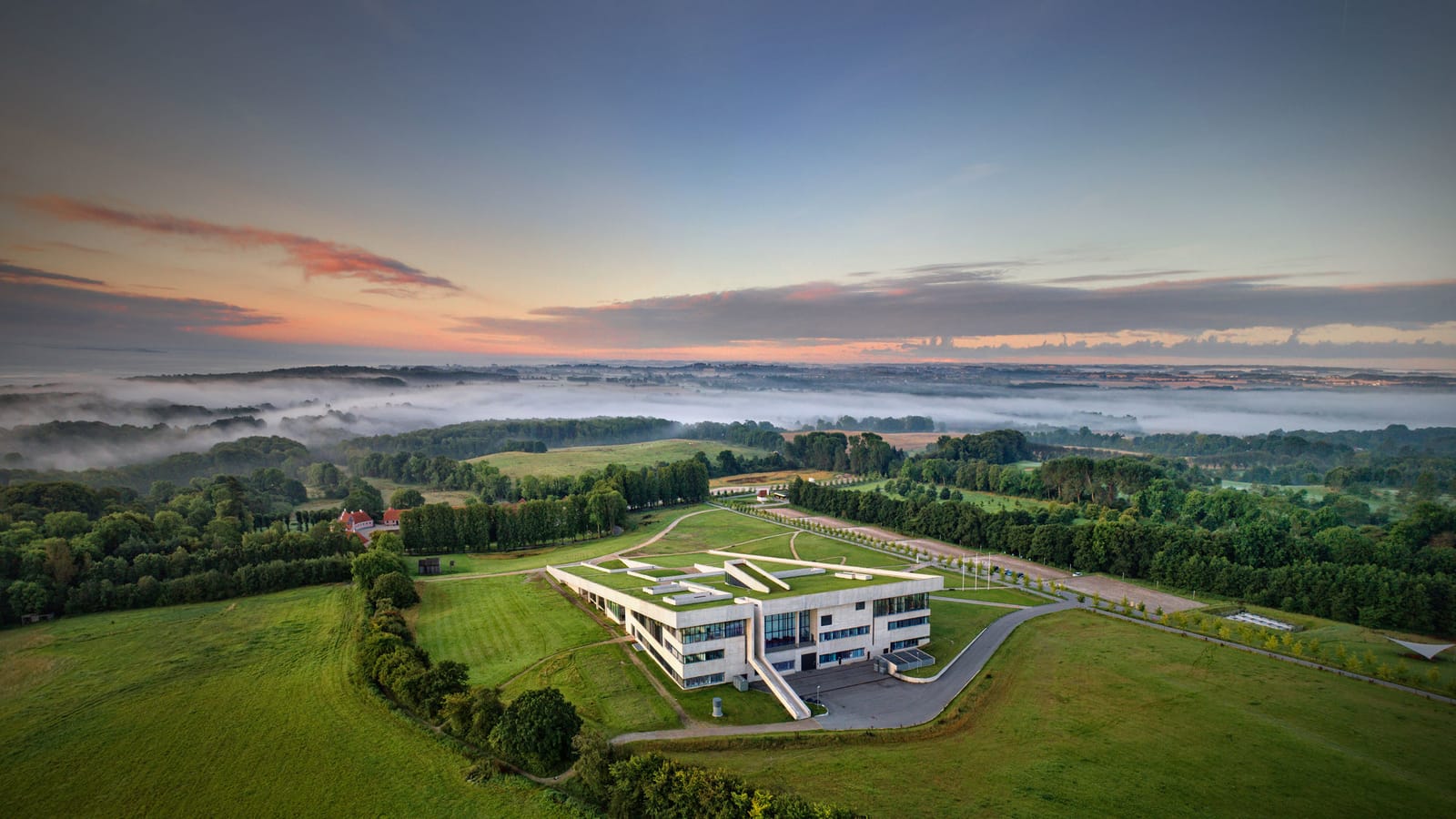 The museum building and its grass roof in the landscape south of Aarhus