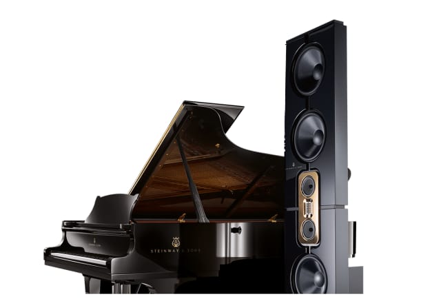 The Model D beside a Steinway & Sons grand piano