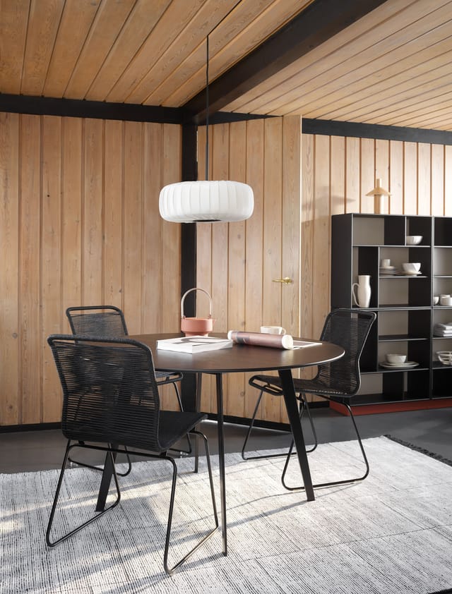 Panton One chairs in black at a dining table