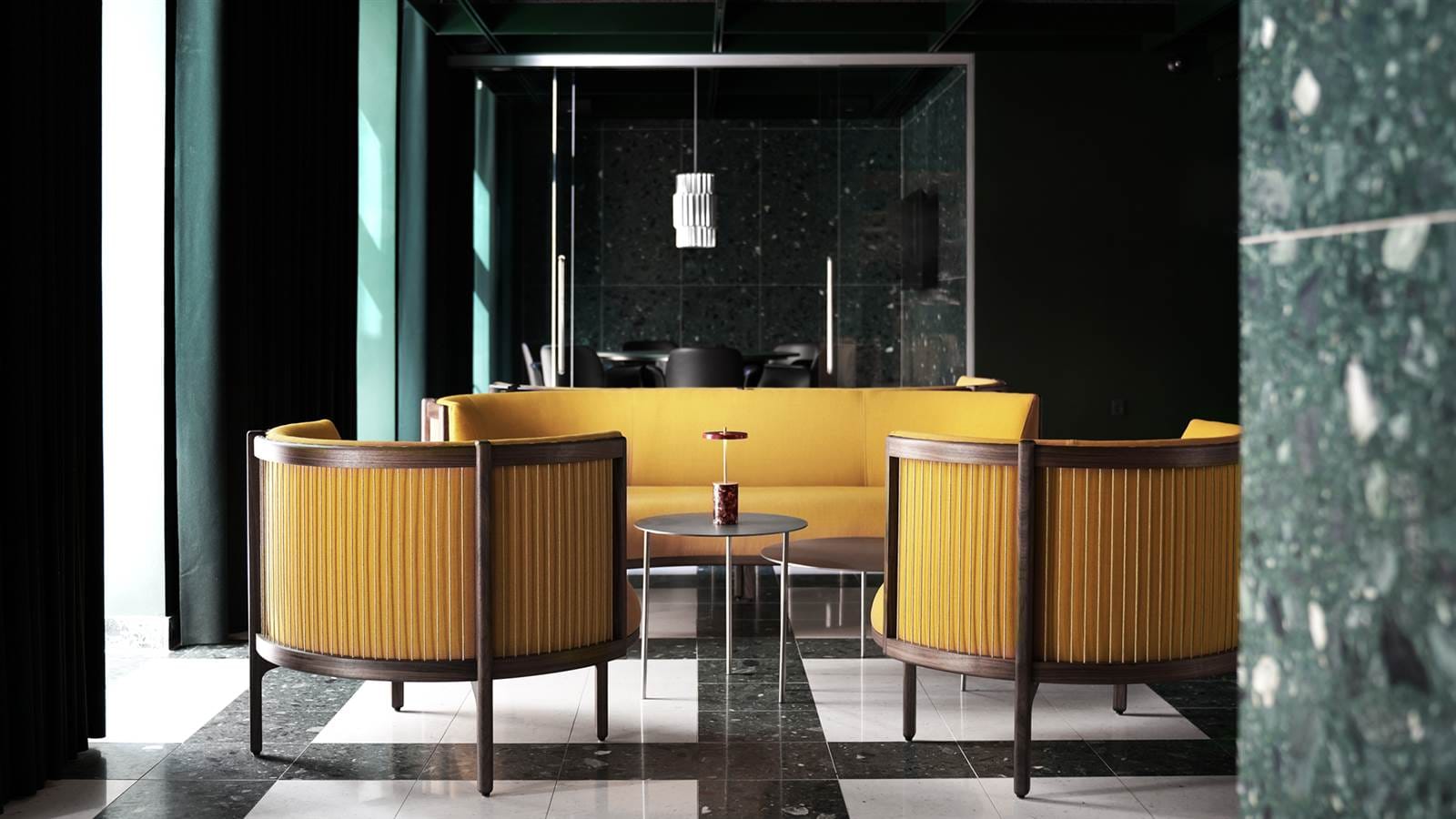 The social space with yellow armchairs and marble