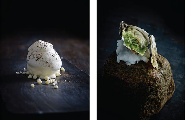 A white dessert and an oyster on a stone