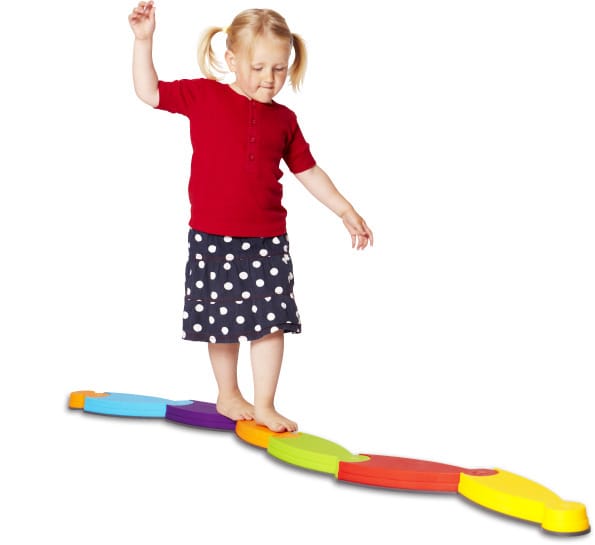 A child balancing on a Gonge movement toy