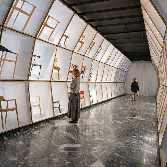 Danish chairs in lit cases in the museum's Danish Modern gallery