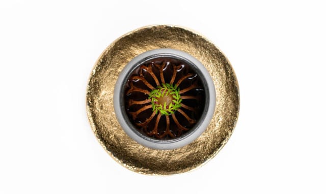A dish served in a gold bowl