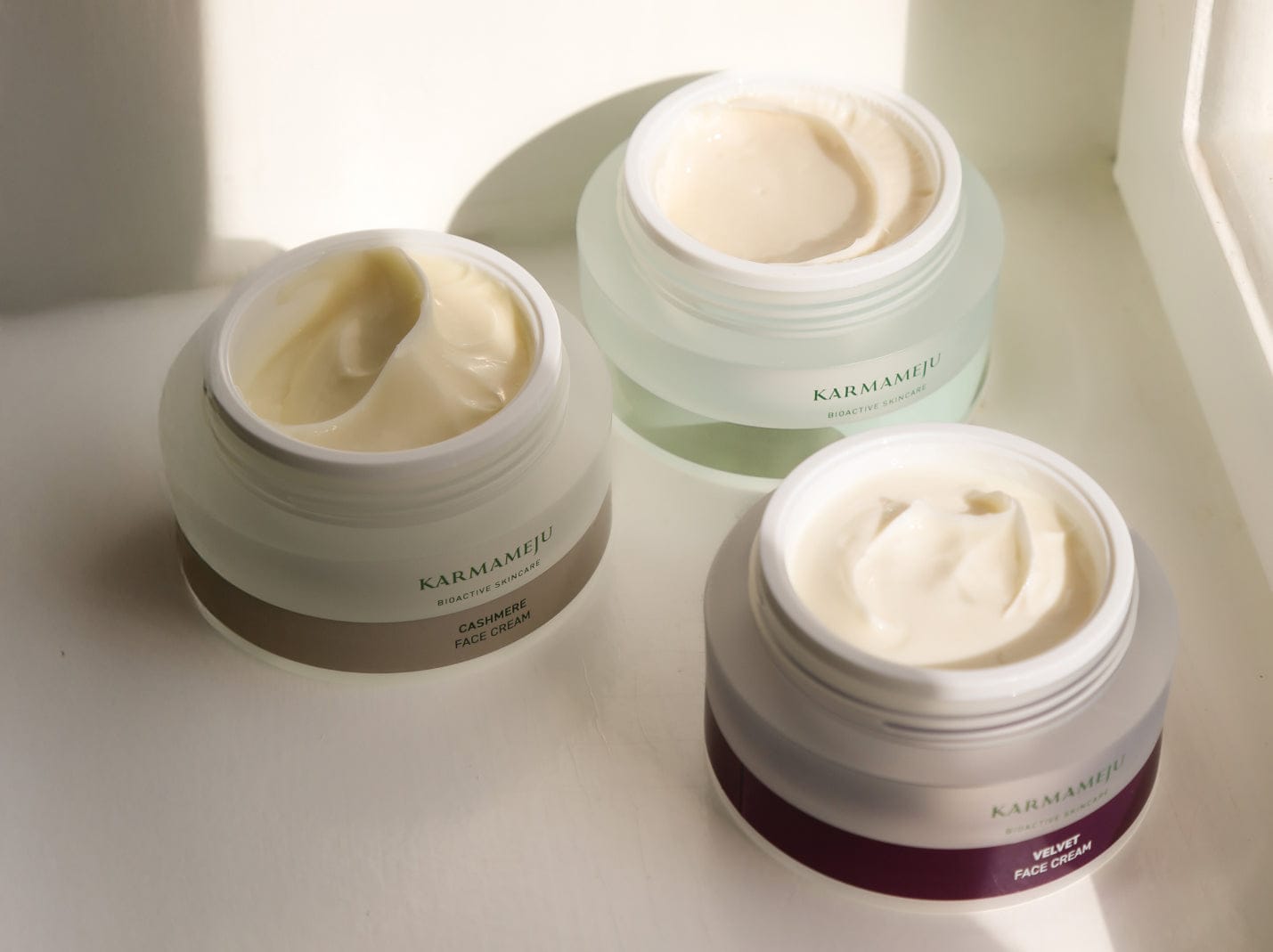 Cashmere and Velvet face creams in open jars