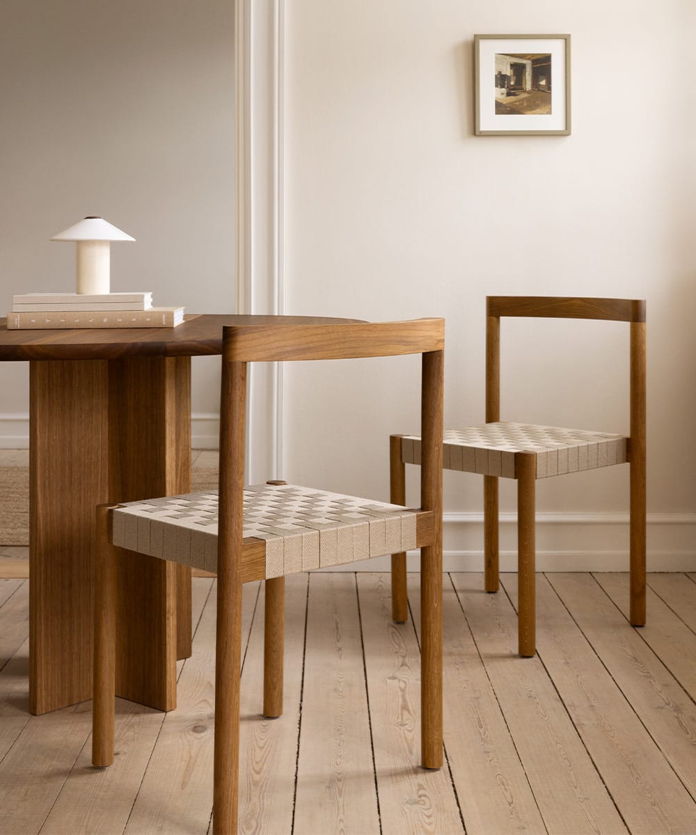 Two Ekko chairs in oak with woven webbing seats