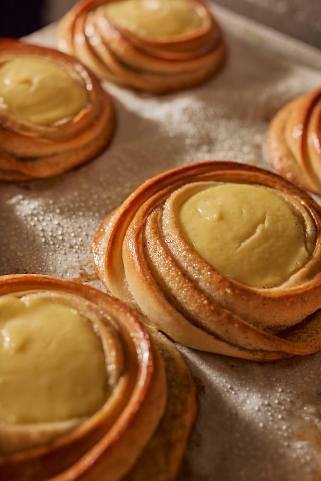 Custard buns on a baking sheet
