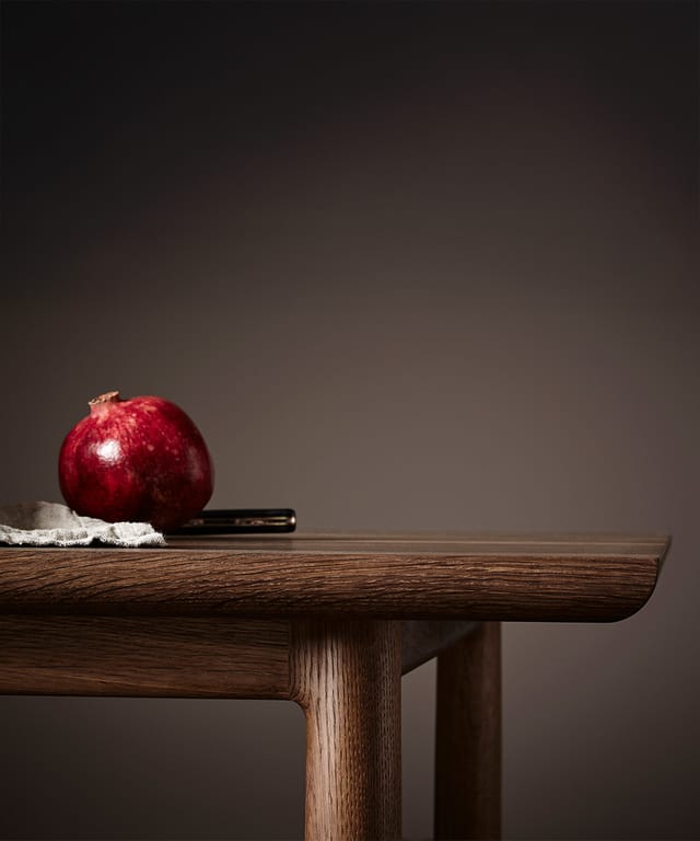 The rounded edge of the Arv table top