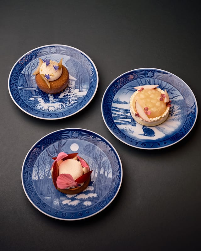Pastries from the cake trolley on blue Christmas plates
