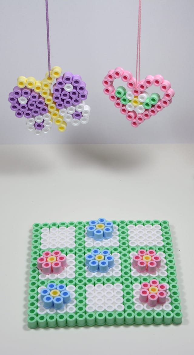 Hama beads ironed into a butterfly, a heart and a flowered mat