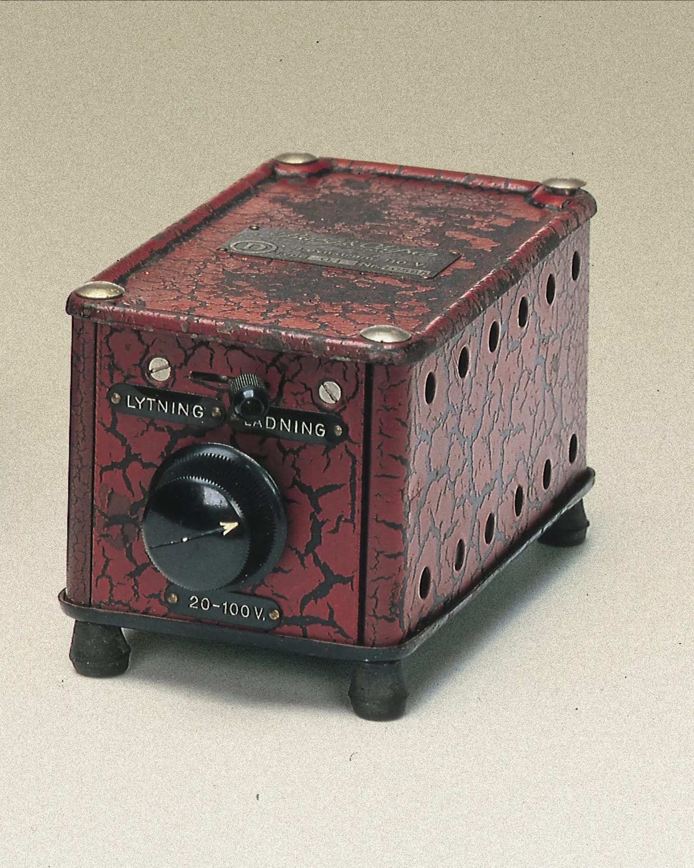 The Eliminator, a red crackle-finish box with a voltage dial