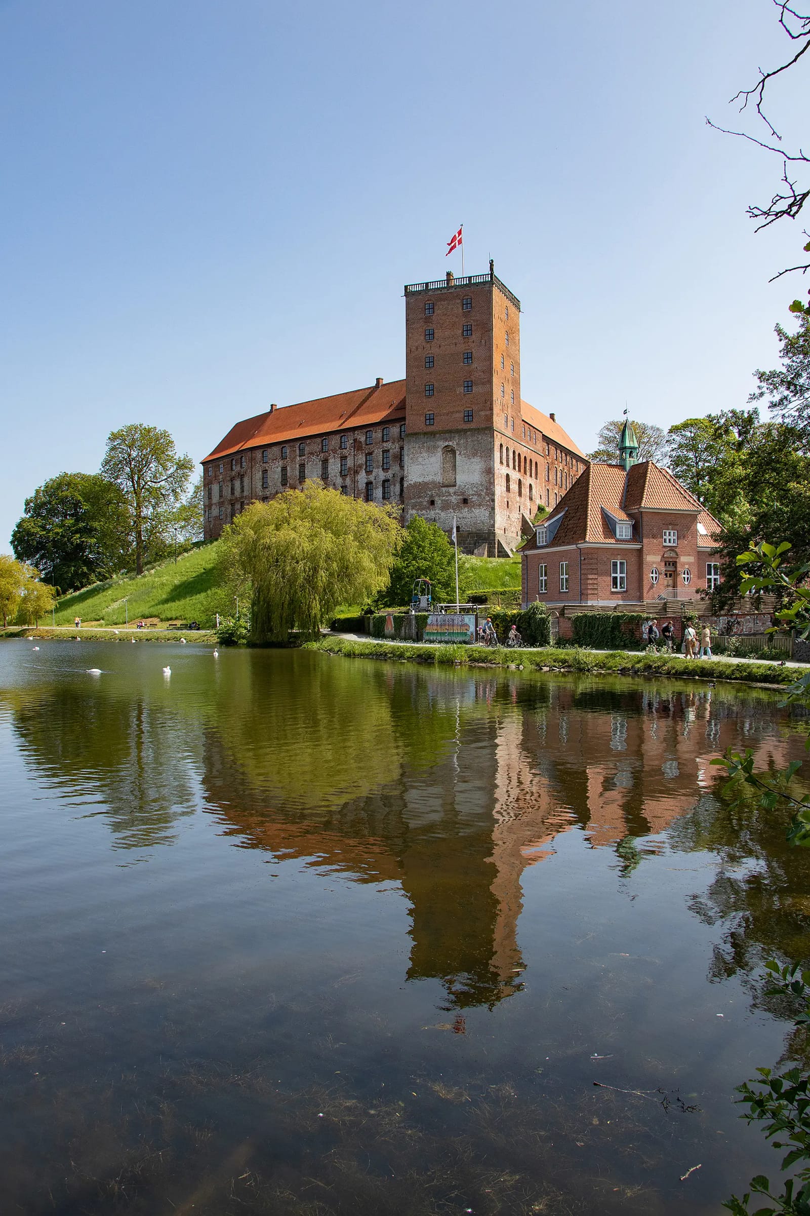 The castle and its Great Tower above the lake in Kolding