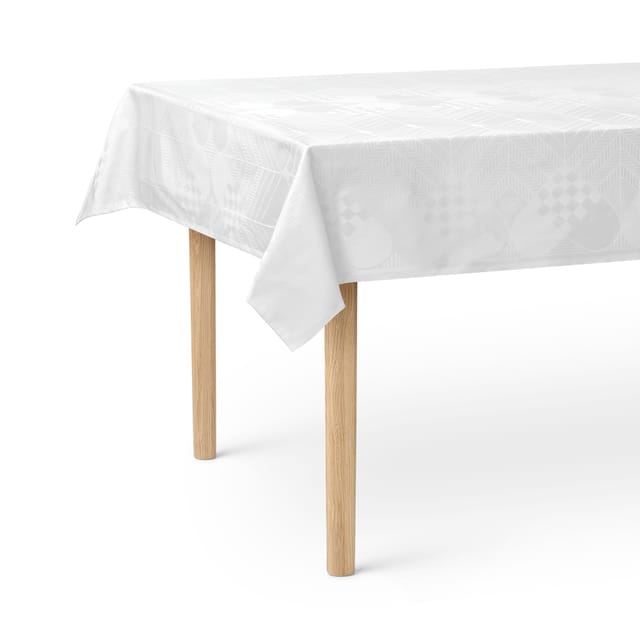 The white Christmas tablecloth with its heart and spruce pattern