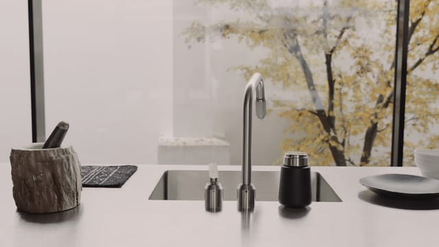 The stainless-steel worktop with sink and Vipp tap