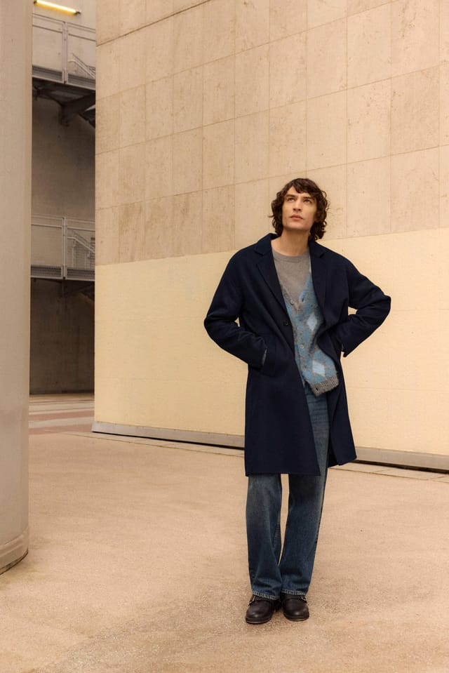 The navy Kendrick coat worn open, full length