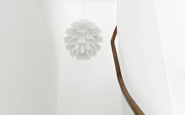 Norm 69 over a stairwell