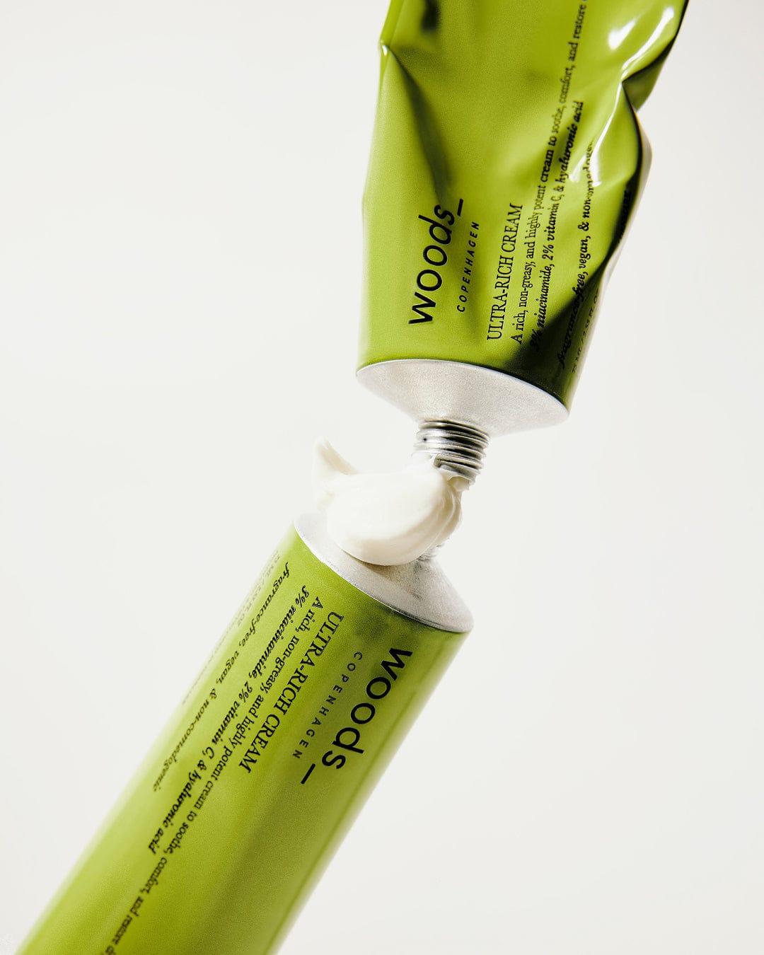 Two green tubes of Ultra-Rich Cream, one open
