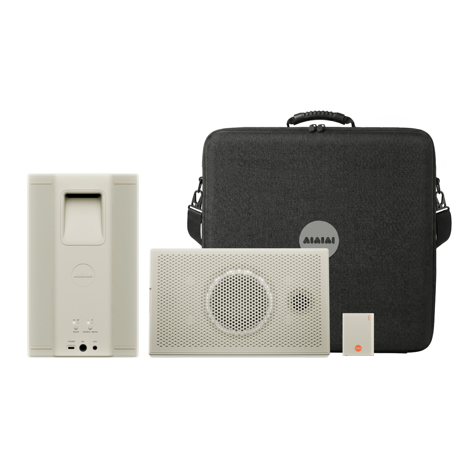 A pair of UNIT-4 speakers in white with transmitter and case