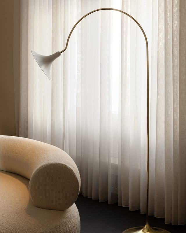 Petalii Floor beside a sofa by a curtained window