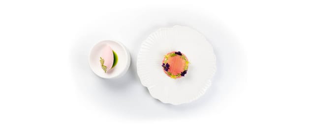 A dessert course with a pink sorbet