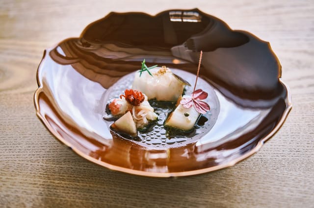 Shellfish and vegetables in a lacquered bowl