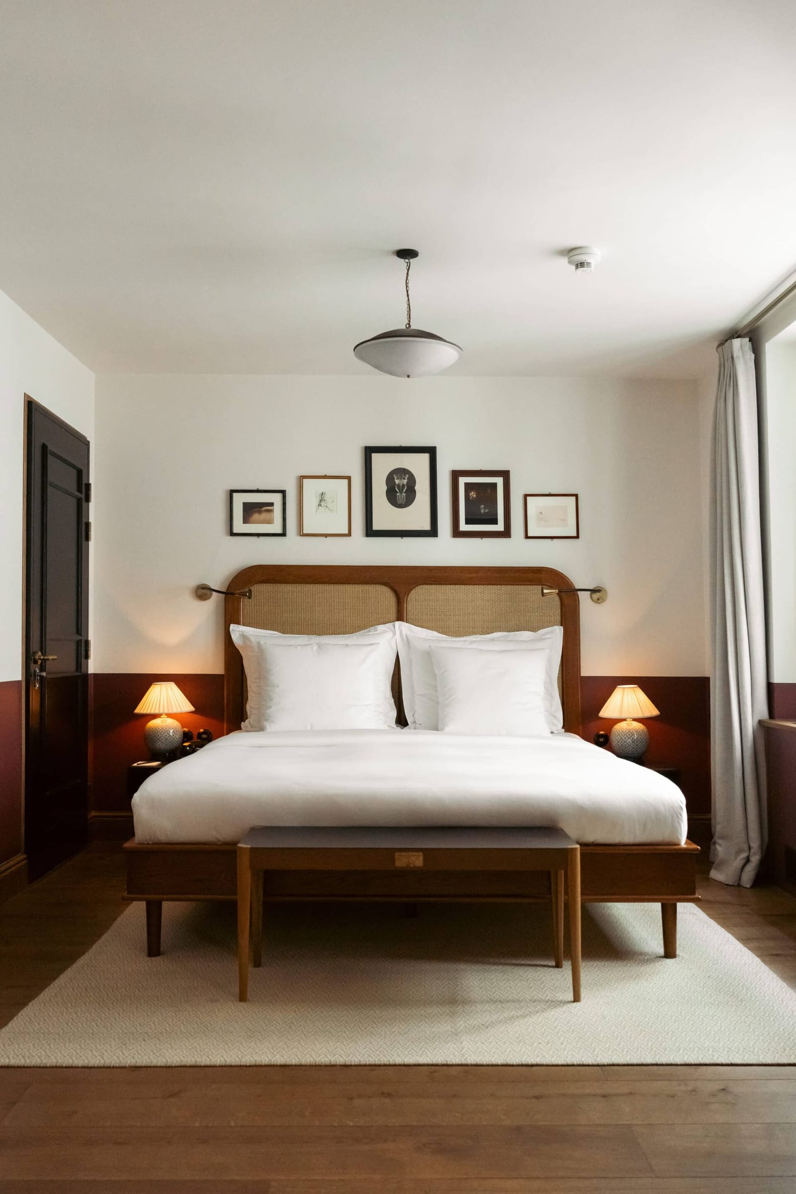 A bedroom with a rattan headboard