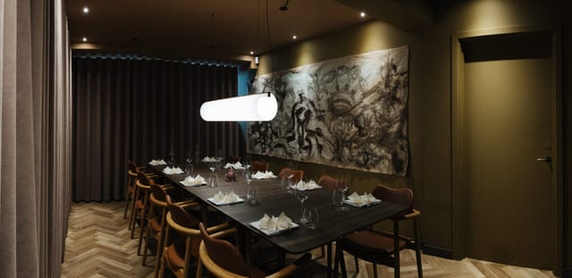 Long table under a pendant lamp