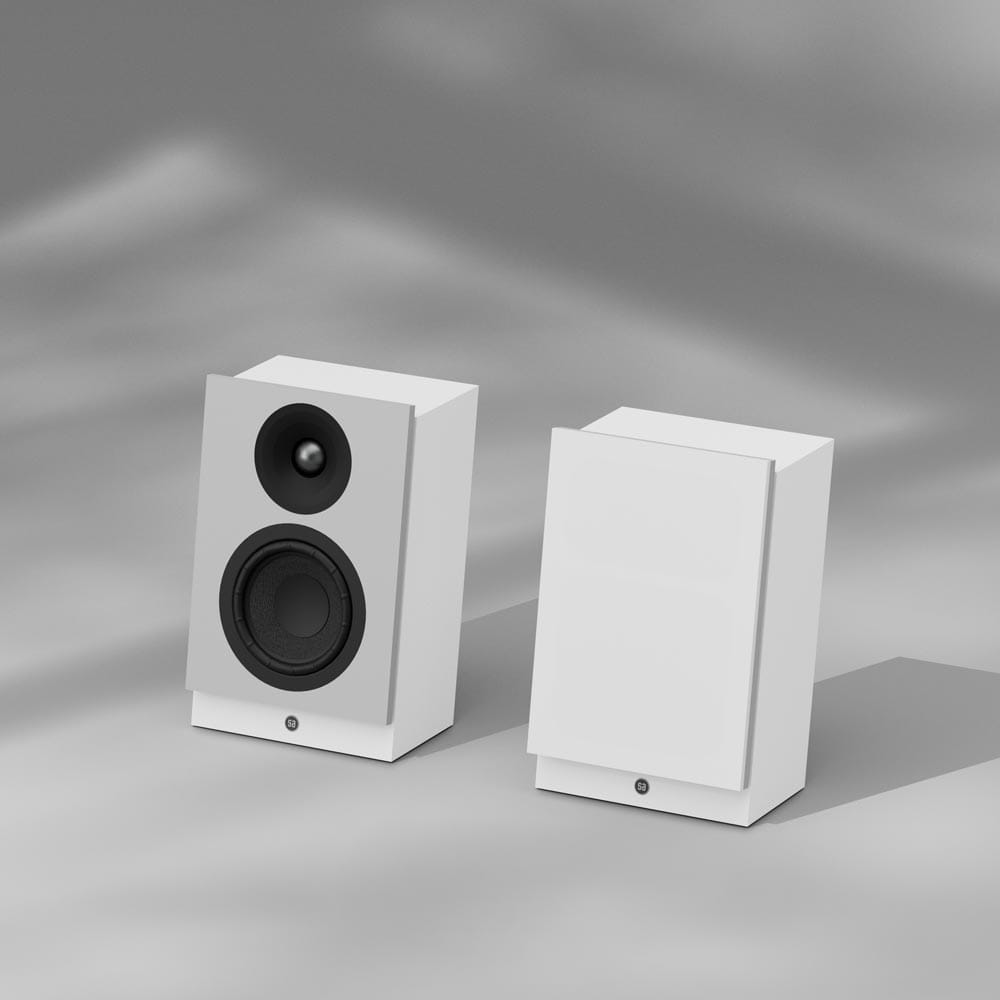 A pair of Silverback 1 speakers in white, one with its grille on
