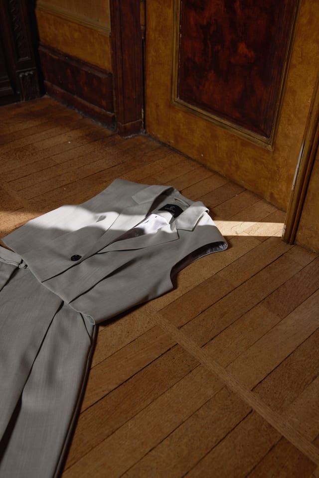 A grey tailored waistcoat and trousers