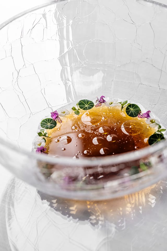 A broth in a glass bowl