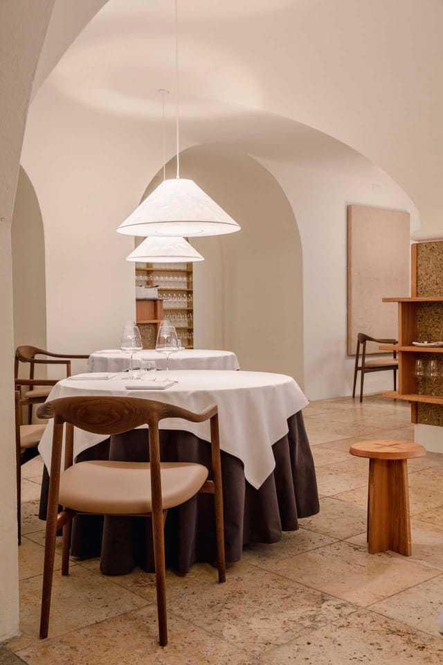 Round tables under the cellar vaults