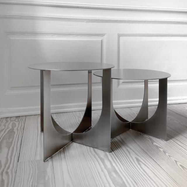 The two heights side by side on a pine floor