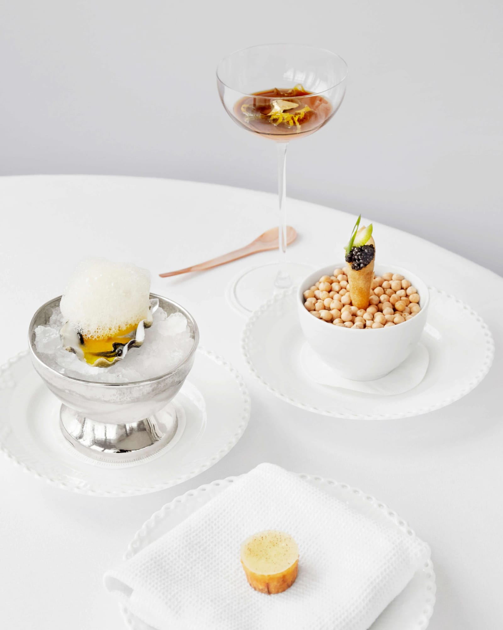 Snacks and an aperitif on a laid table
