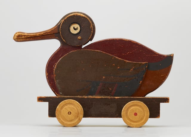 An early LEGO wooden pull-along duck