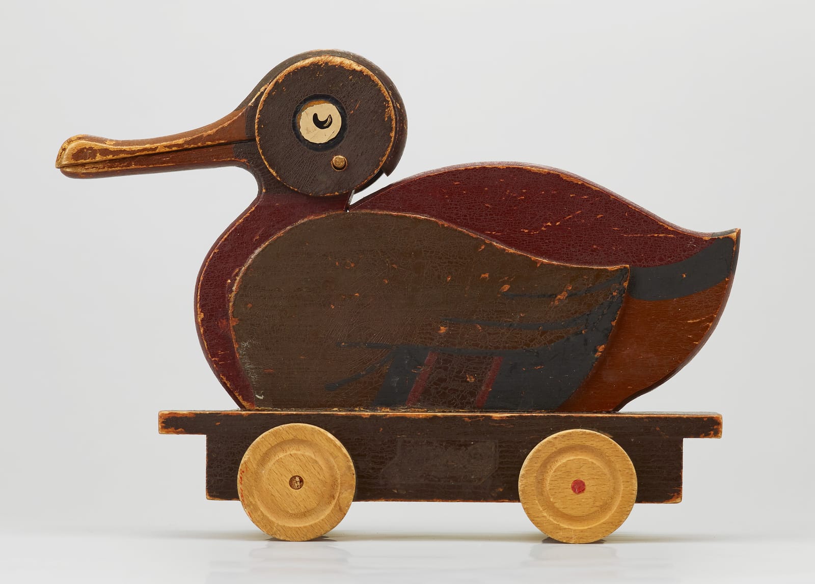 An early LEGO wooden pull-along duck