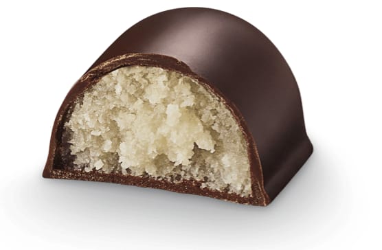 Marzipan bread cut open, marzipan inside dark chocolate