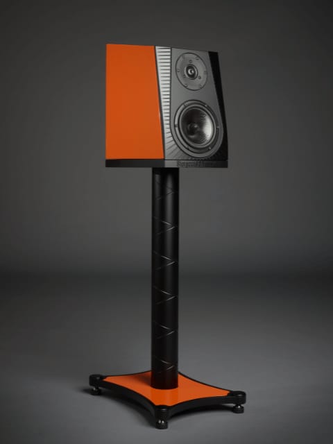 The Frida in orange on its stand