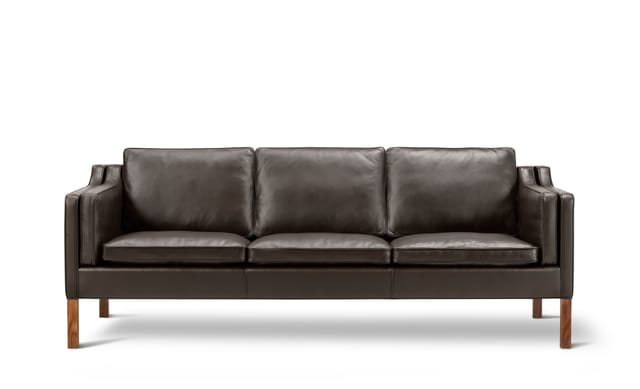 The 2213 Sofa in leather on walnut