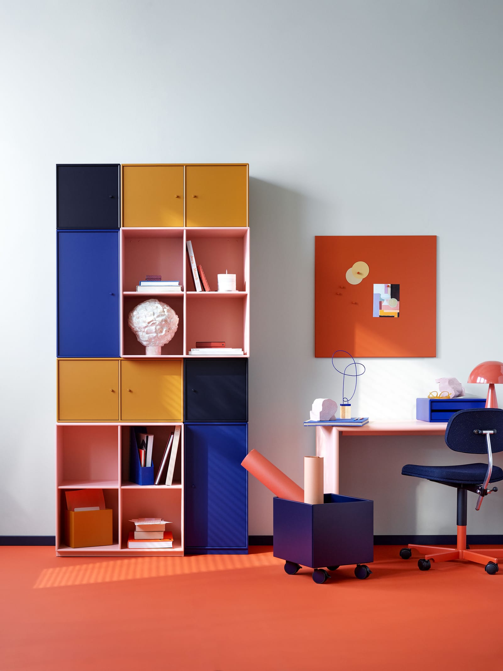 Montana System modules in several colours beside a desk