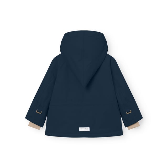 The MATWANG winter jacket in navy, from the back