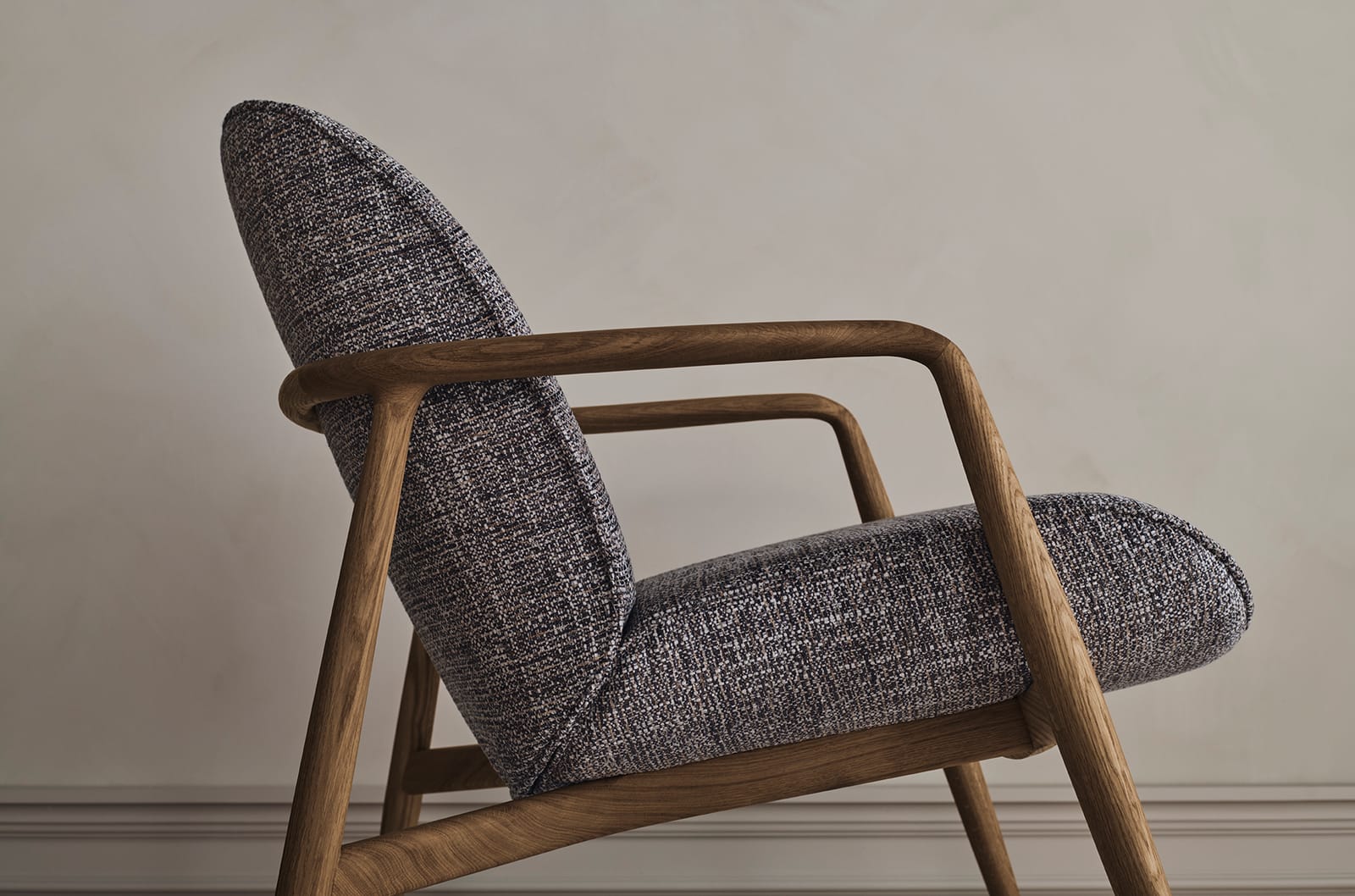 Upholstered armchair on an oak frame