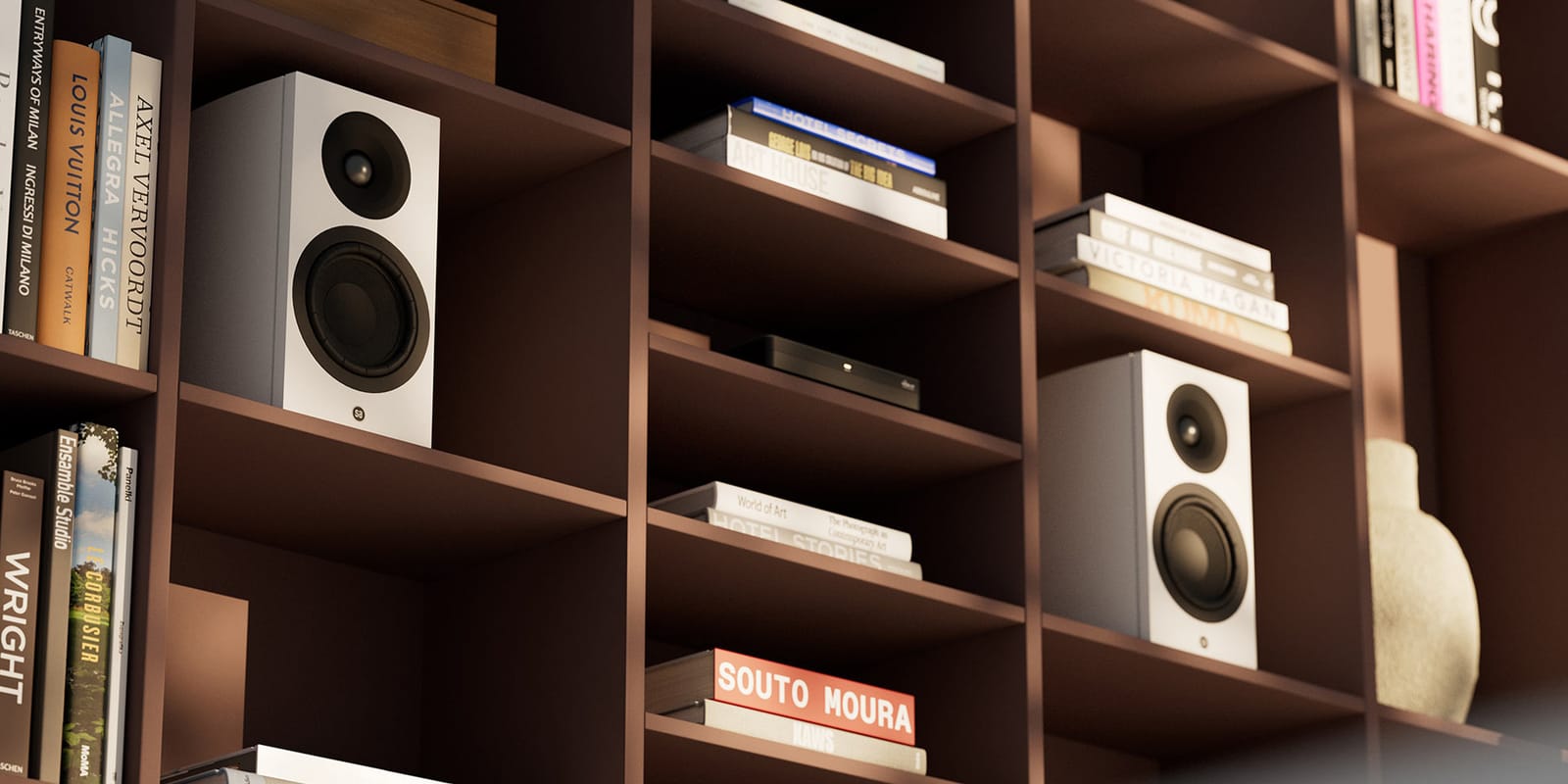 A pair of Legend 5.2 Silverback DS speakers in white on a bookshelf
