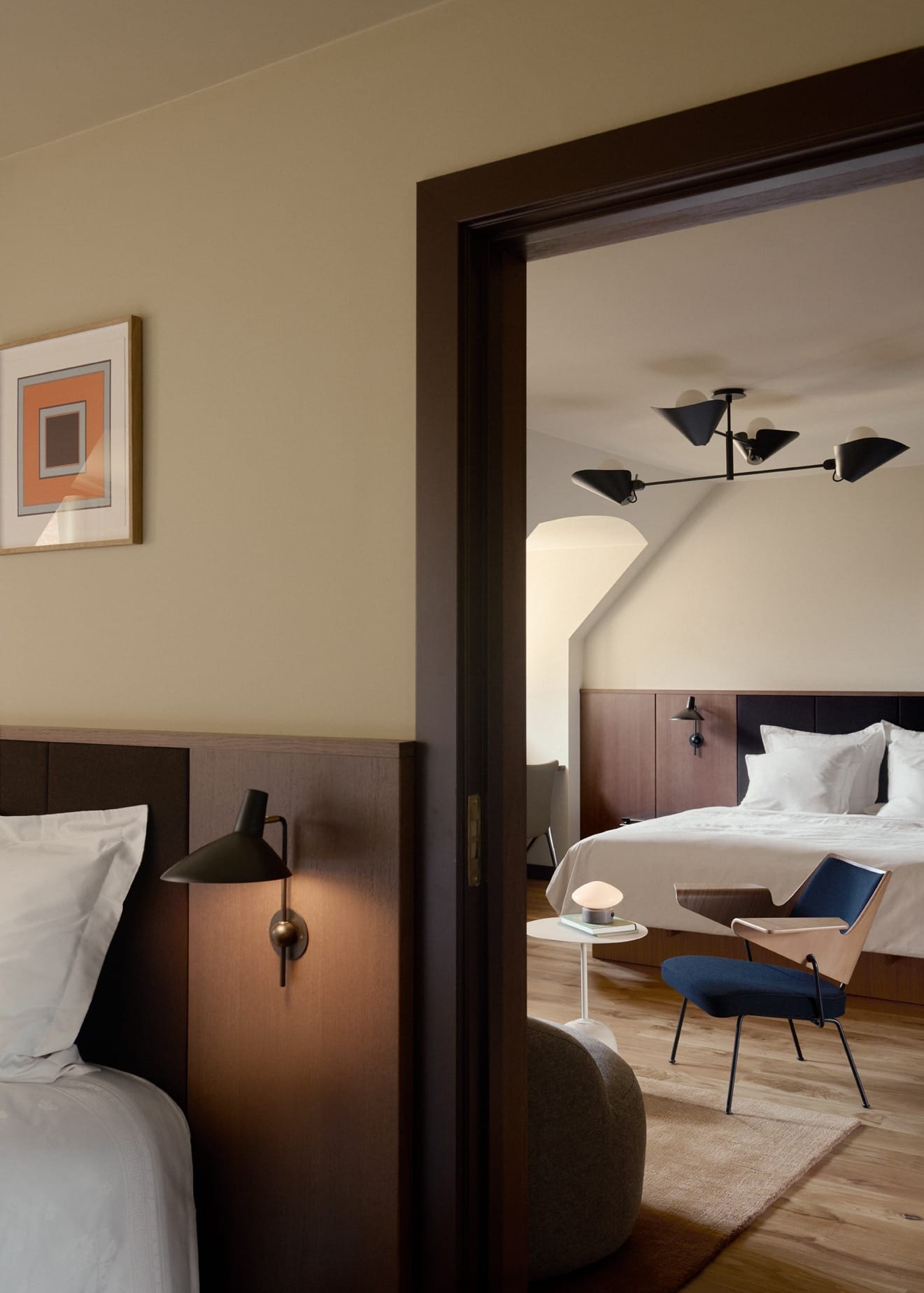 A suite with oak panelling under the sloping roof