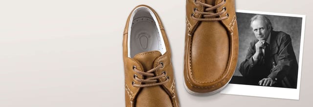 An early ECCO lace-up shoe beside a portrait of Karl Toosbuy