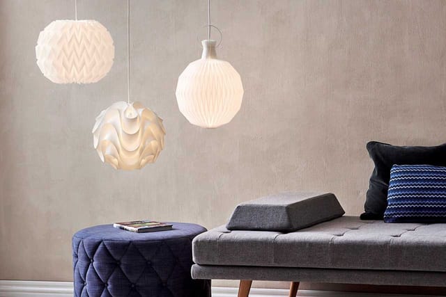 Model 101 lit, beside other Le Klint pendants