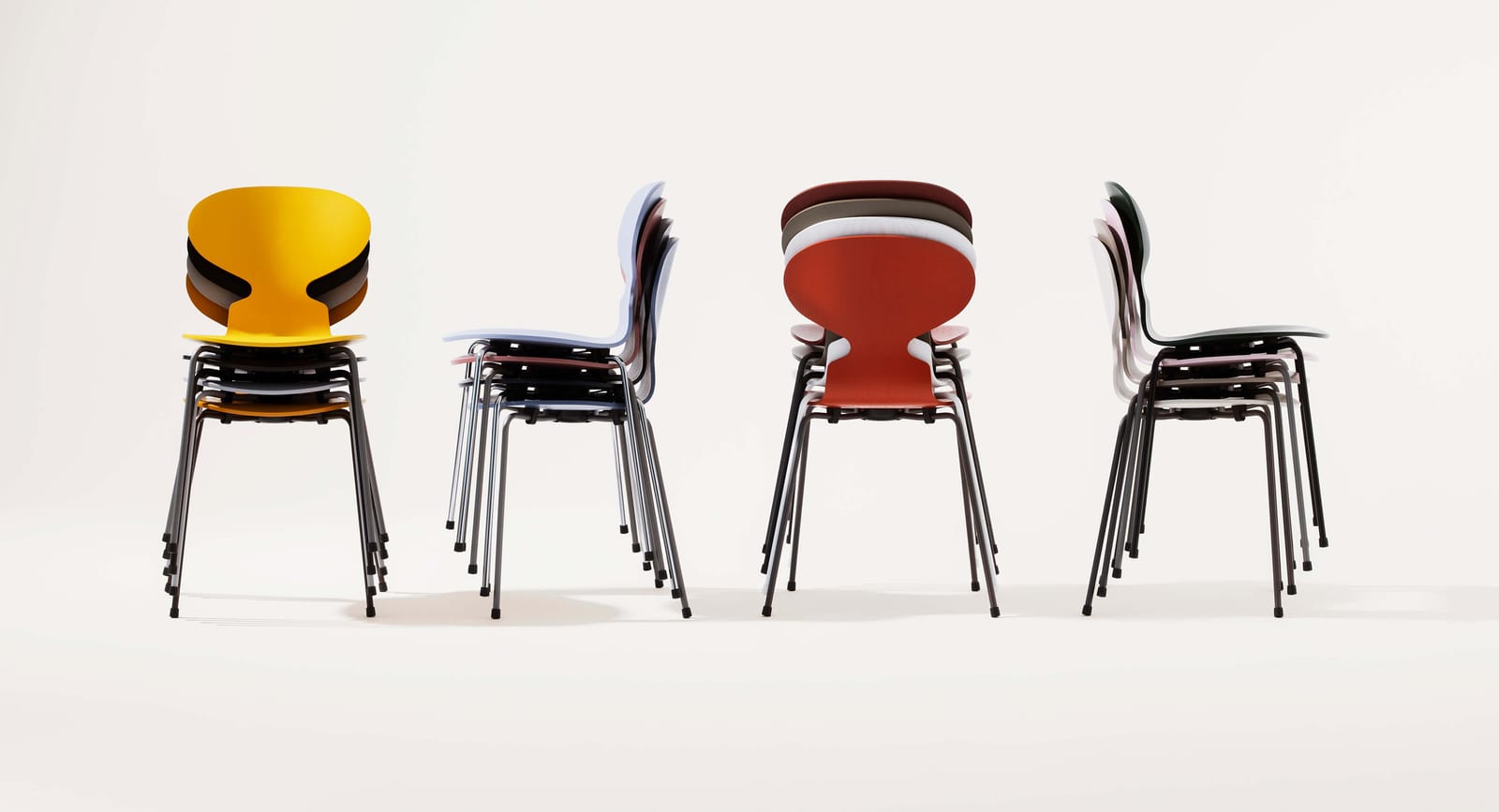 Ant chairs stacked, showing the shell and steel legs