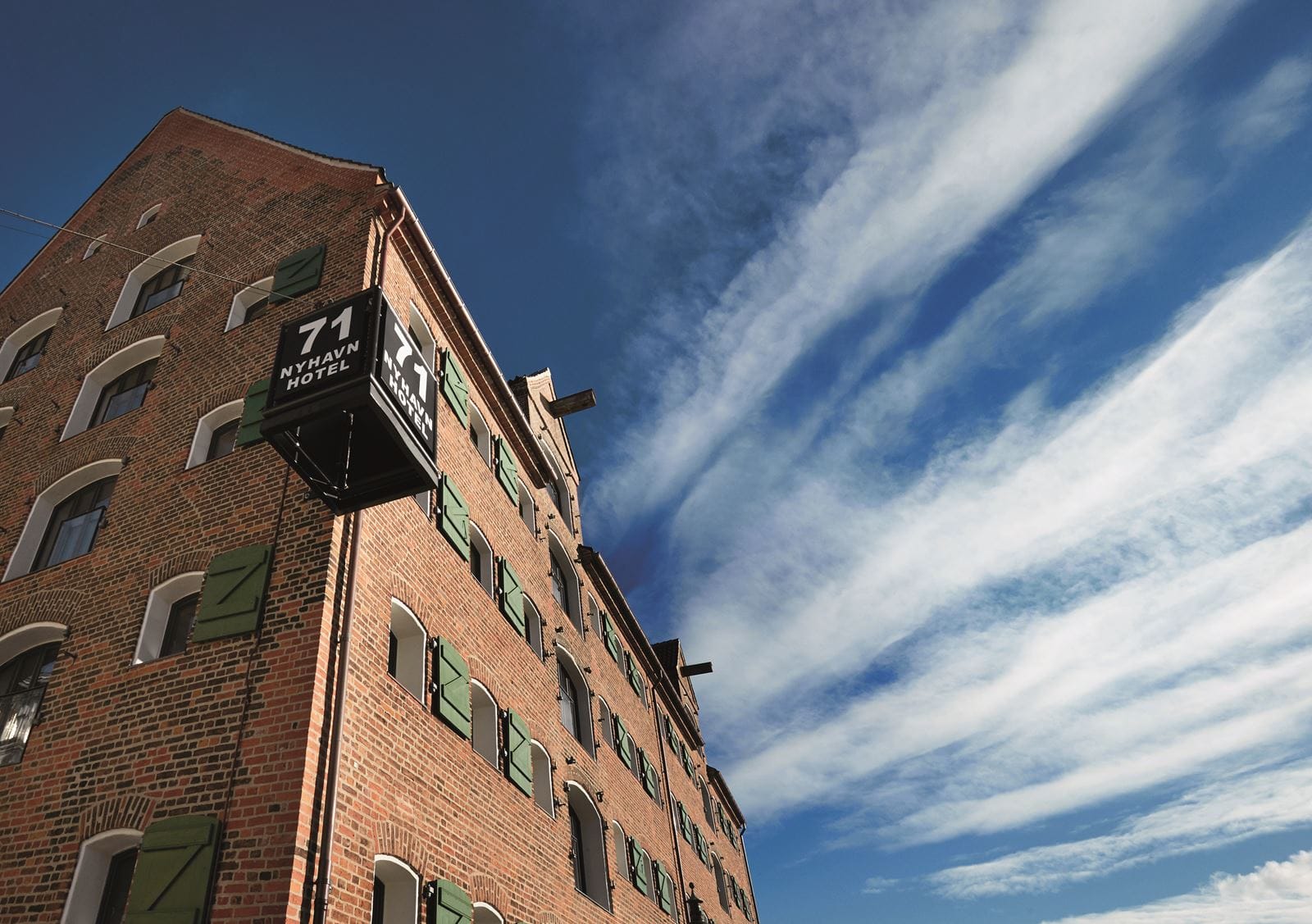The brick warehouse with its green shutters