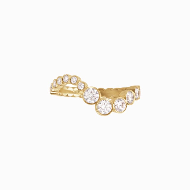 A gold ring set with a curve of diamonds