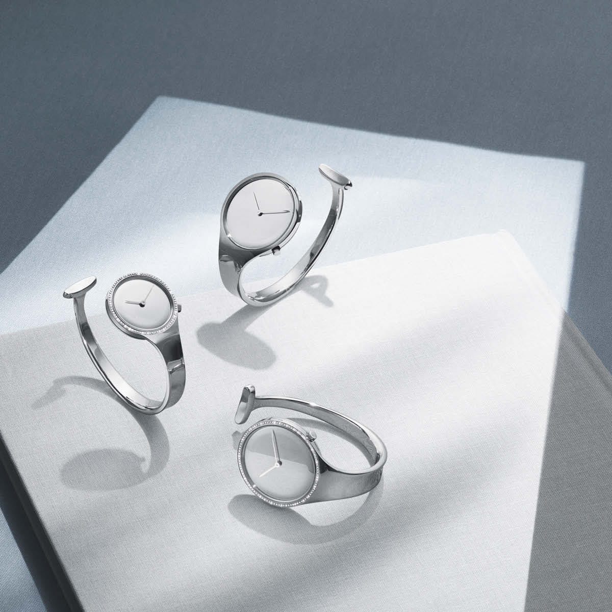 Three Torun bangle watches in steel