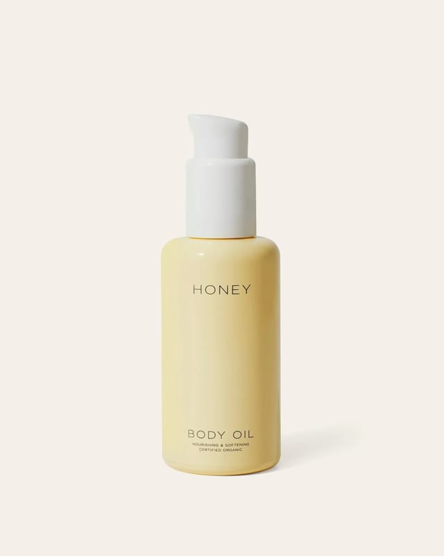 HONEY Body Oil in its bottle